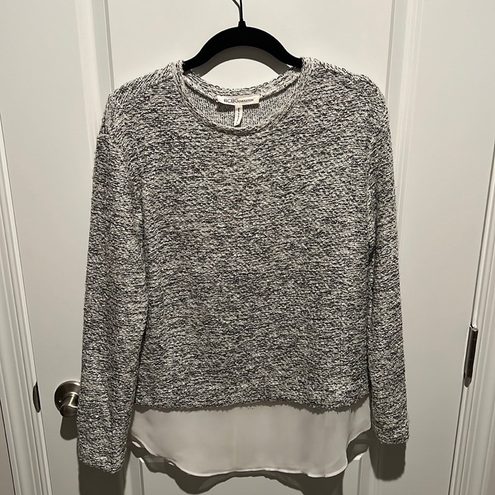 BCBG generation white and black sweater top with sheer detail at bottom
